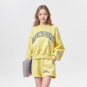 a woman in yellow set Factory-customized fashionable women's sporty style heavyweight pure cotton daily casual set